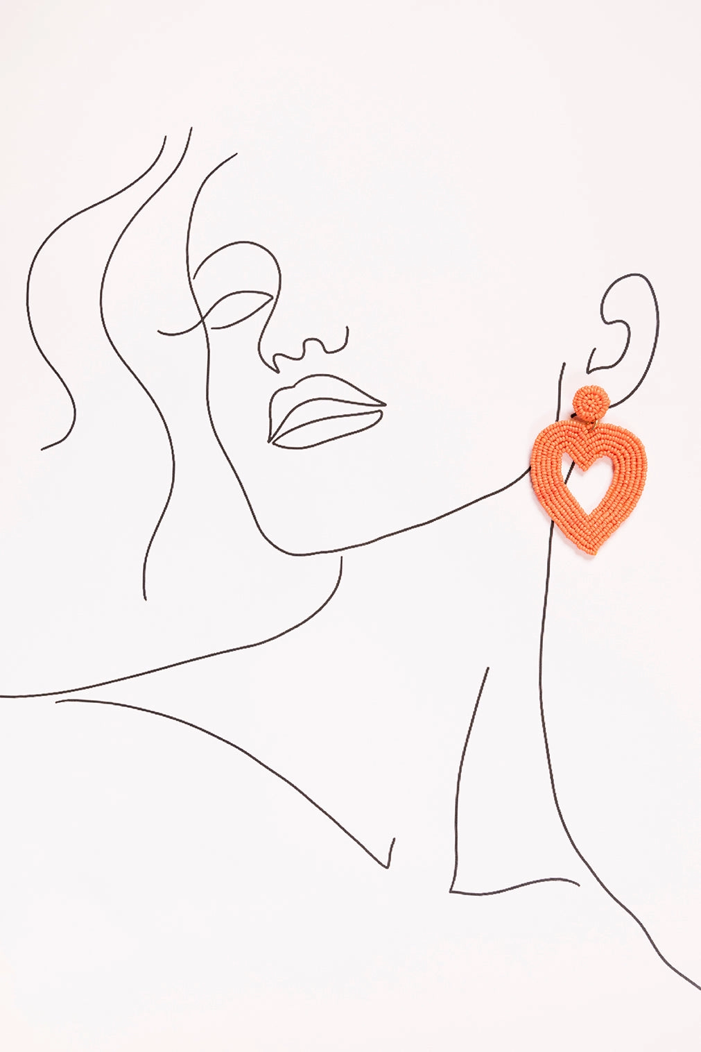 Hollow Heart Beaded Earrings in Orange